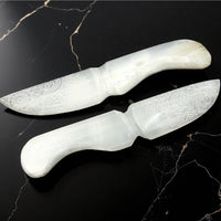 White decorative knives with intricate etched floral patterns on blades for Selenite Dagger 9 inch product
