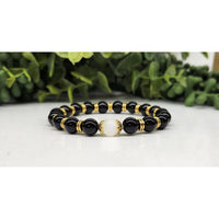 Black onyx and gold beaded bracelet with white moonstone accent, 8mm, 7.5 inches