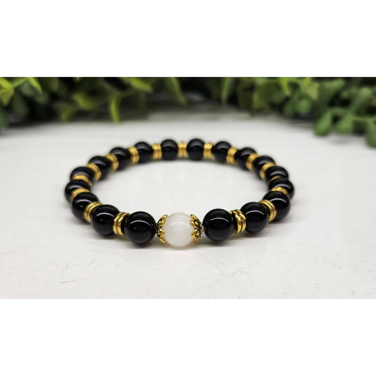 Glossy black obsidian bracelet with gold beads and white jade, 8mm, 7.5in LV9535