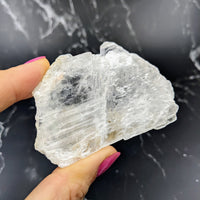 Thumbnail for Close-up of a person holding Selenite Ice Slab Specimen for feng shui (#SK8199)