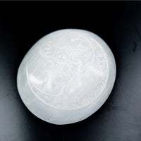 Smooth translucent white Selenite palm stone with carved celestial and crescent moon designs