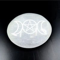Polished white Selenite palm stone with engraved triple moons and pentagram symbol