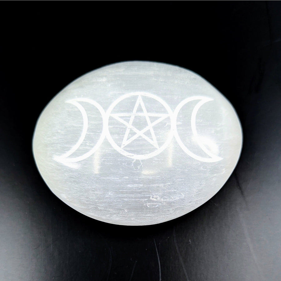 Polished white Selenite palm stone with engraved triple moons and pentagram symbol