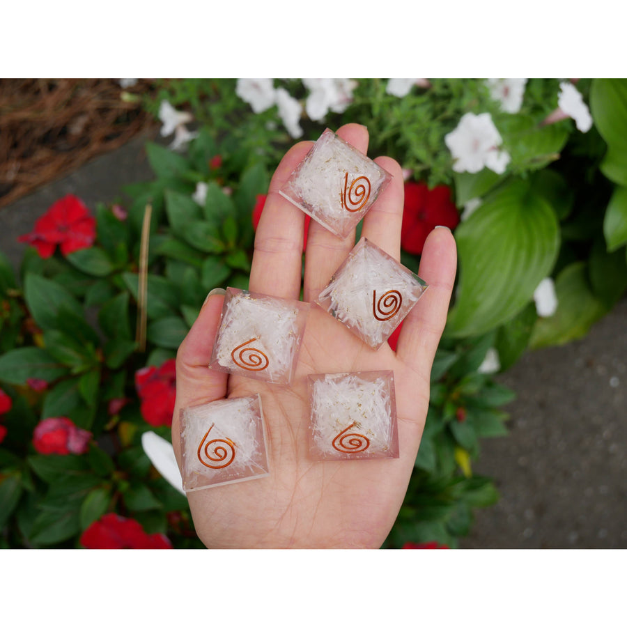 Clear resin squares with embedded copper spiral designs featured in selenite orgonite pyramid 1.2 inch BC0495