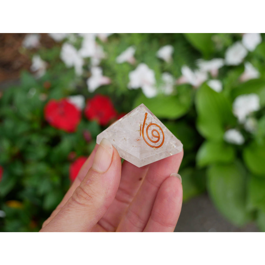 Selenite orgonite pyramid 1.2 inch clear quartz with copper spiral held gently between fingers for energy healing