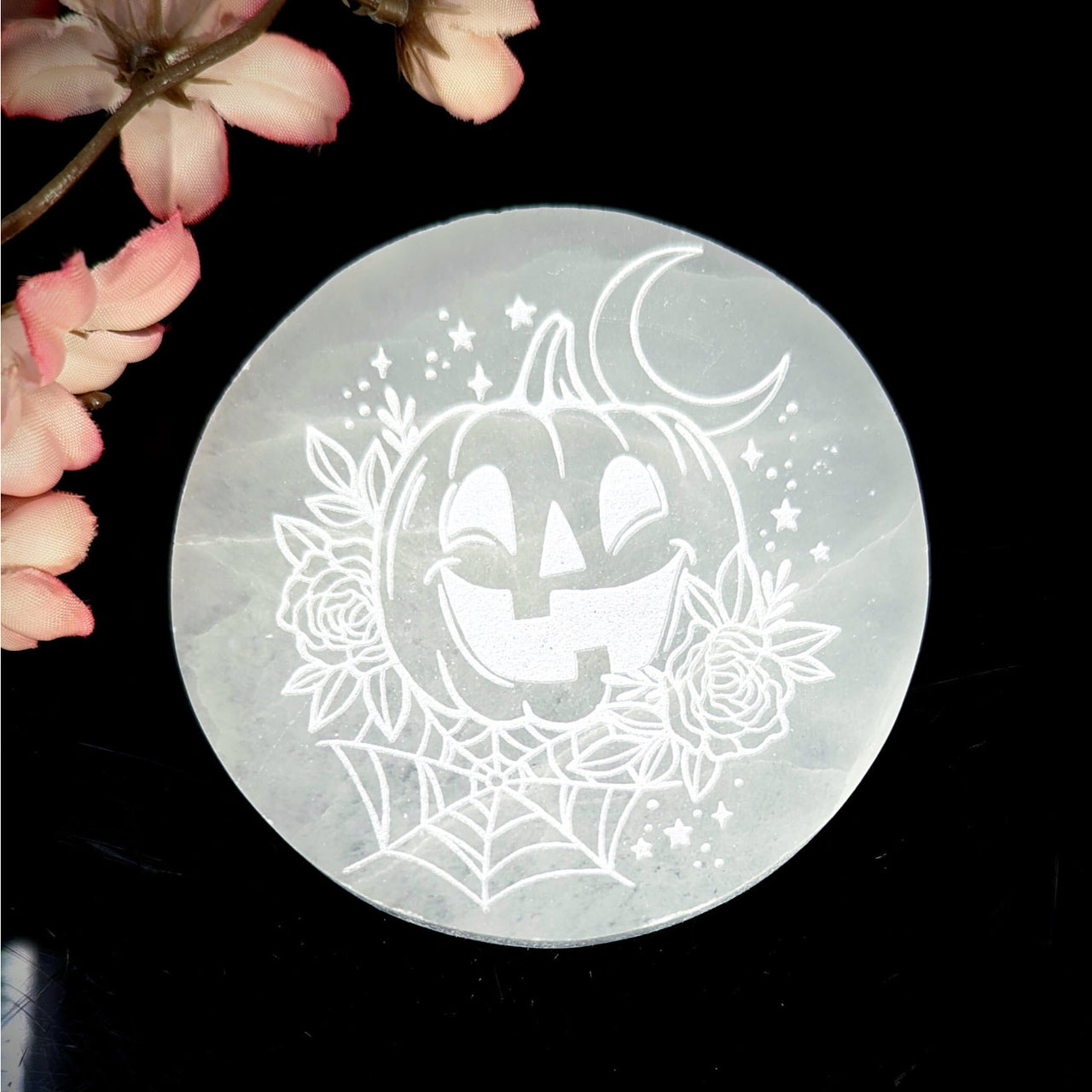 White carved Selenite Plate with Halloween-themed etching for decorative use