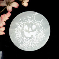 White carved Selenite Plate with Halloween-themed etching for decorative use
