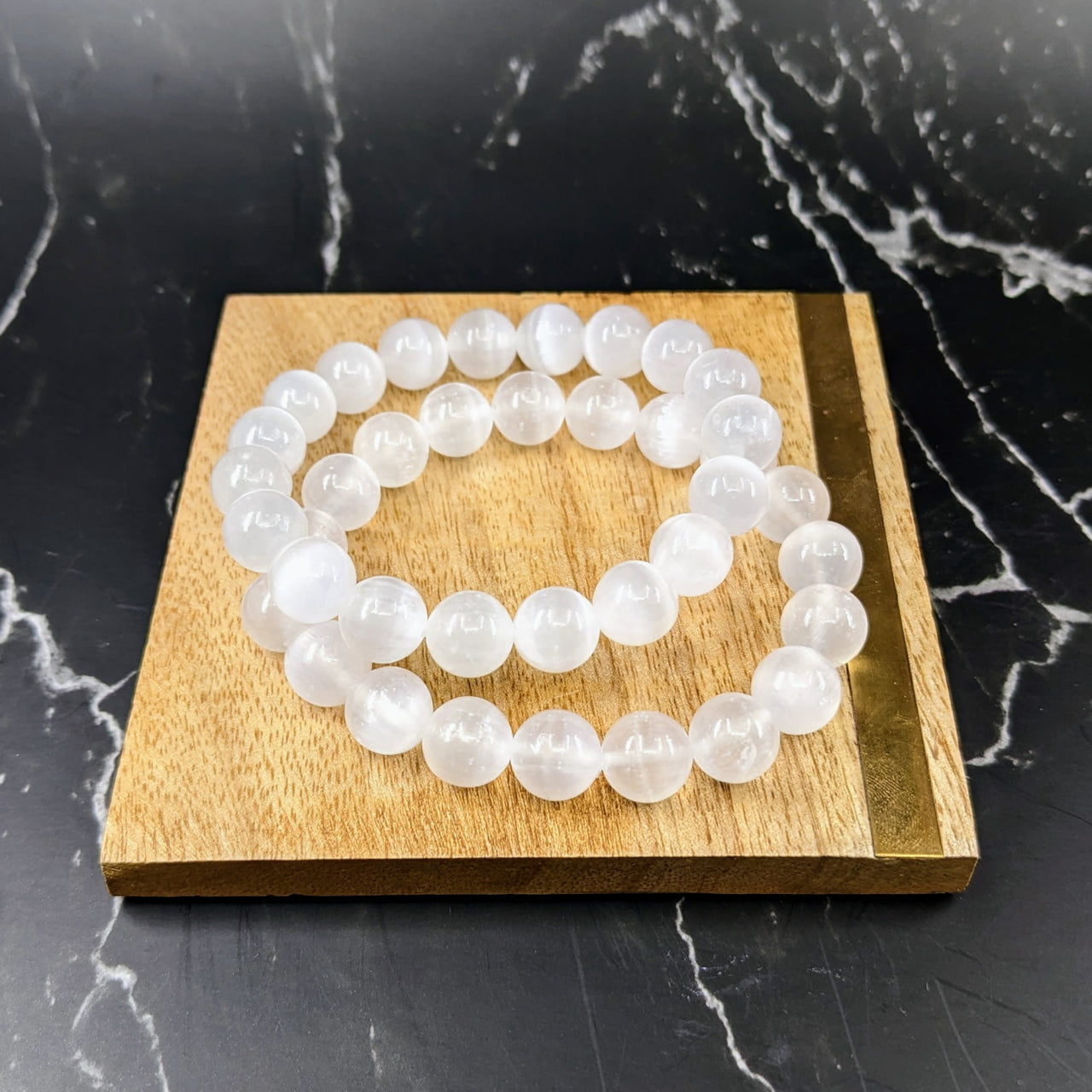 Selenite Round Beaded Bracelet featuring a circle of white beads. #SK7842