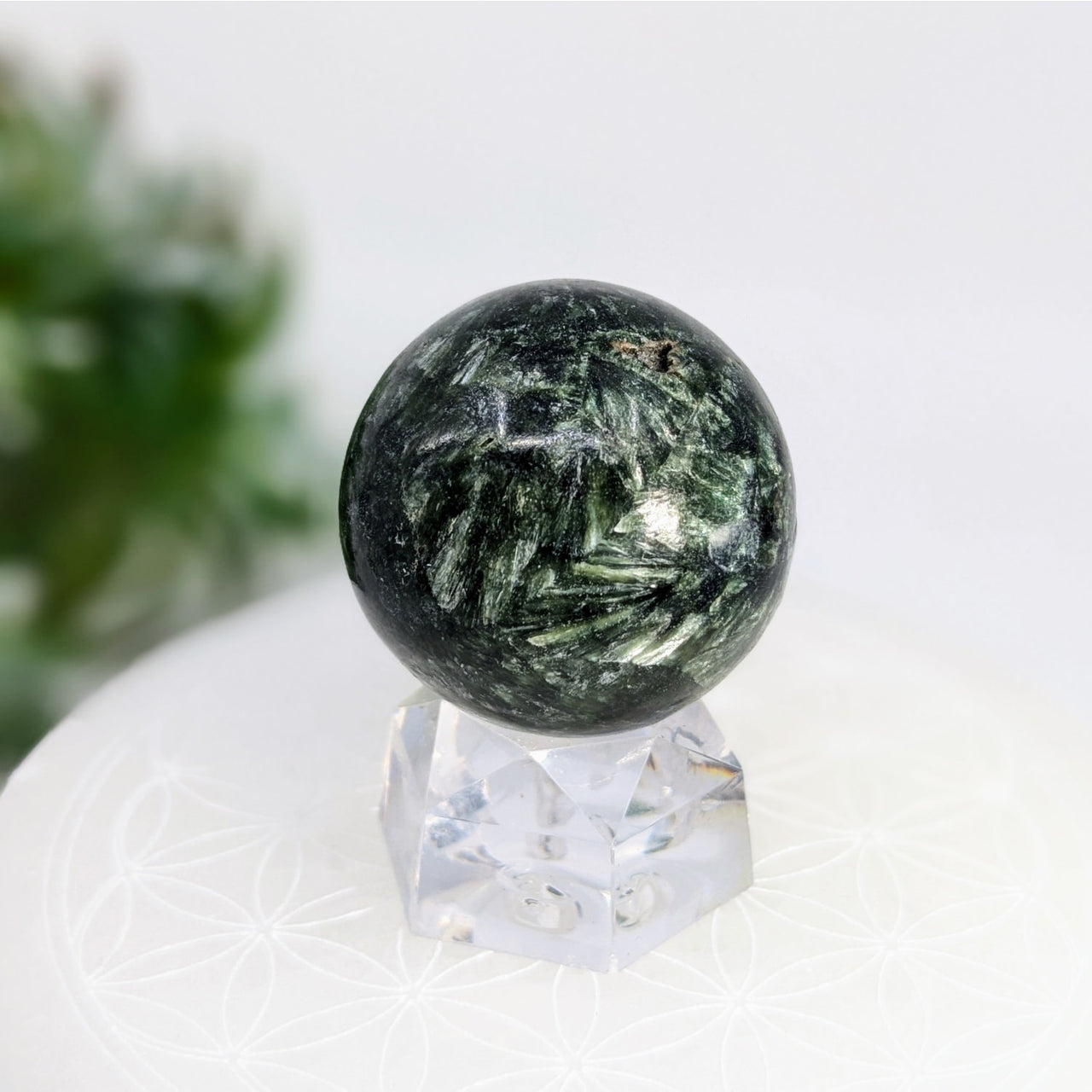 Green and white patterned sphere representing divine feminine energies and biblical seraphs