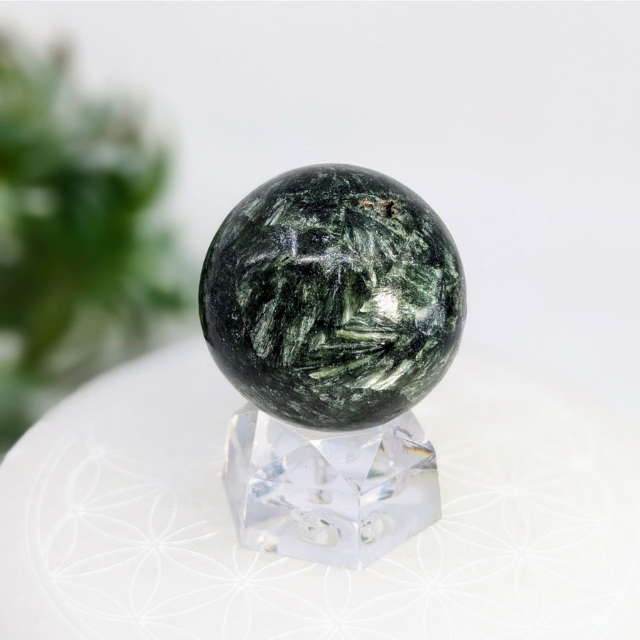 Green and white patterned sphere representing divine feminine energies and biblical seraphs