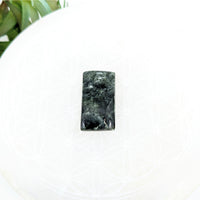 Thumbnail for Dark green Seraphinite 1’’ Cabochon with mottled patterns for unique jewelry designs