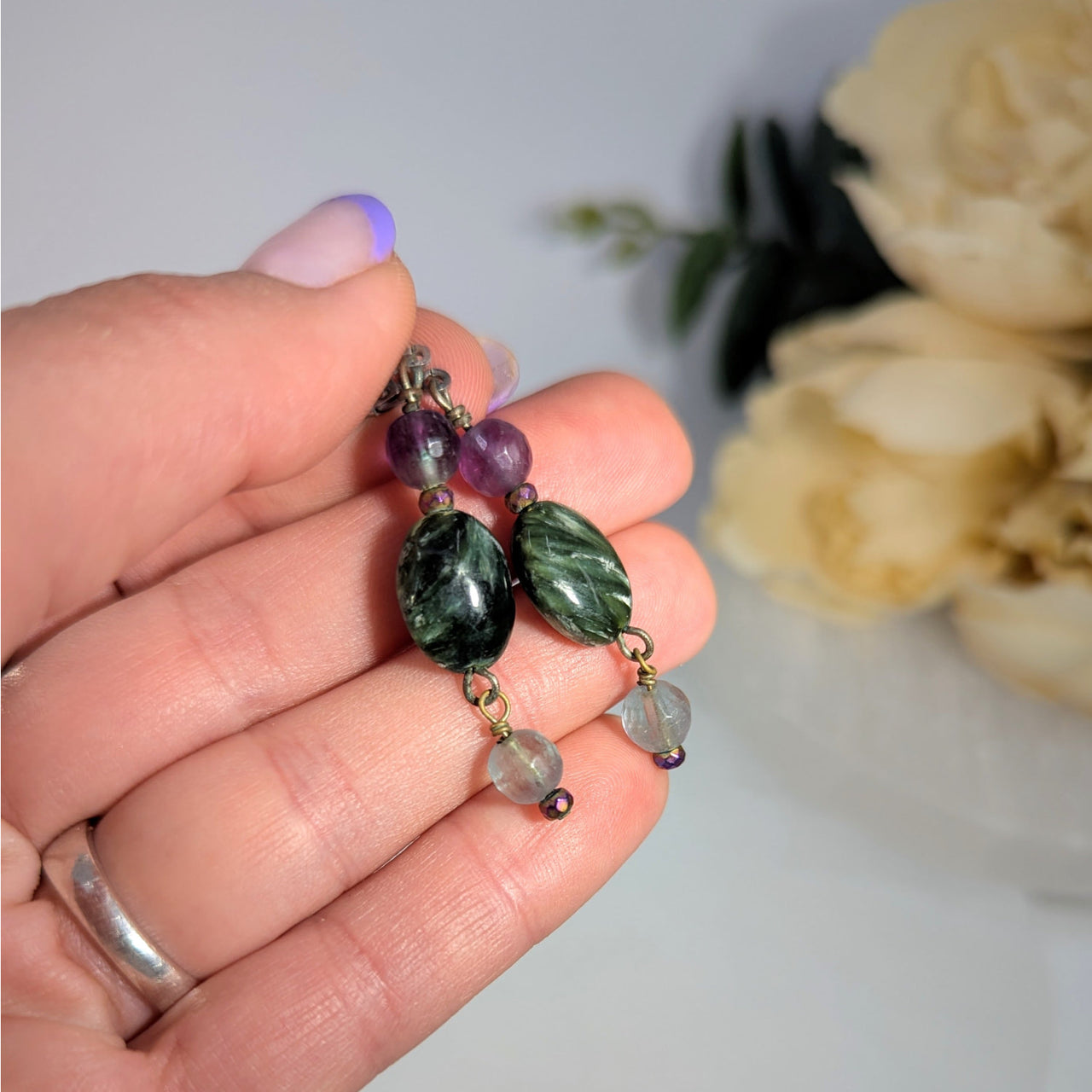 Handmade beaded earrings featuring Seraphinite and Fluorite gemstones from Mama Jan Collection