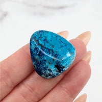 Thumbnail for Tumbled stones: Shattuckite 1.4’ A+ stone with a central hole in blue and white