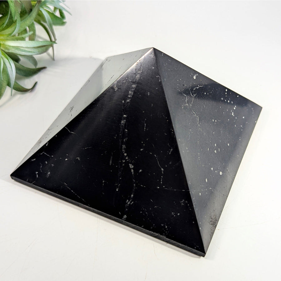 Black marble pyramid for Shungite 4 XL Pyramid product featuring sleek design