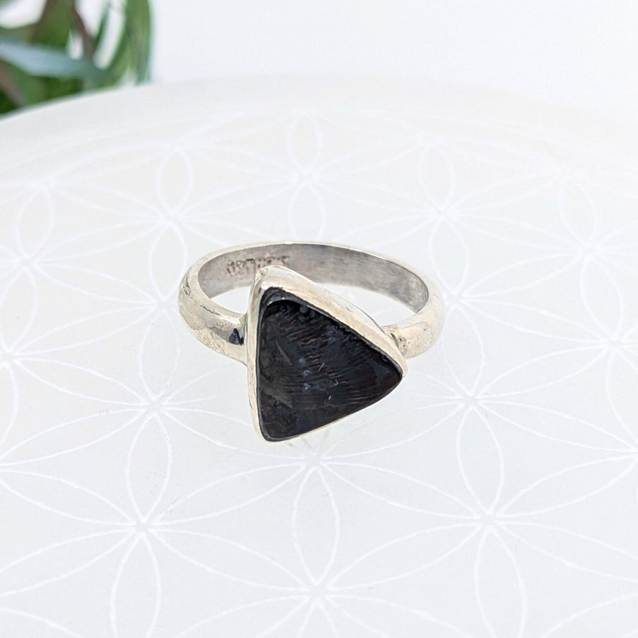 Silver ring with triangular black stone, ideal for deflecting negativity and bliss crystals
