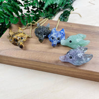 Five intricately carved wolf head gemstone pendants on gold chains, LV9194