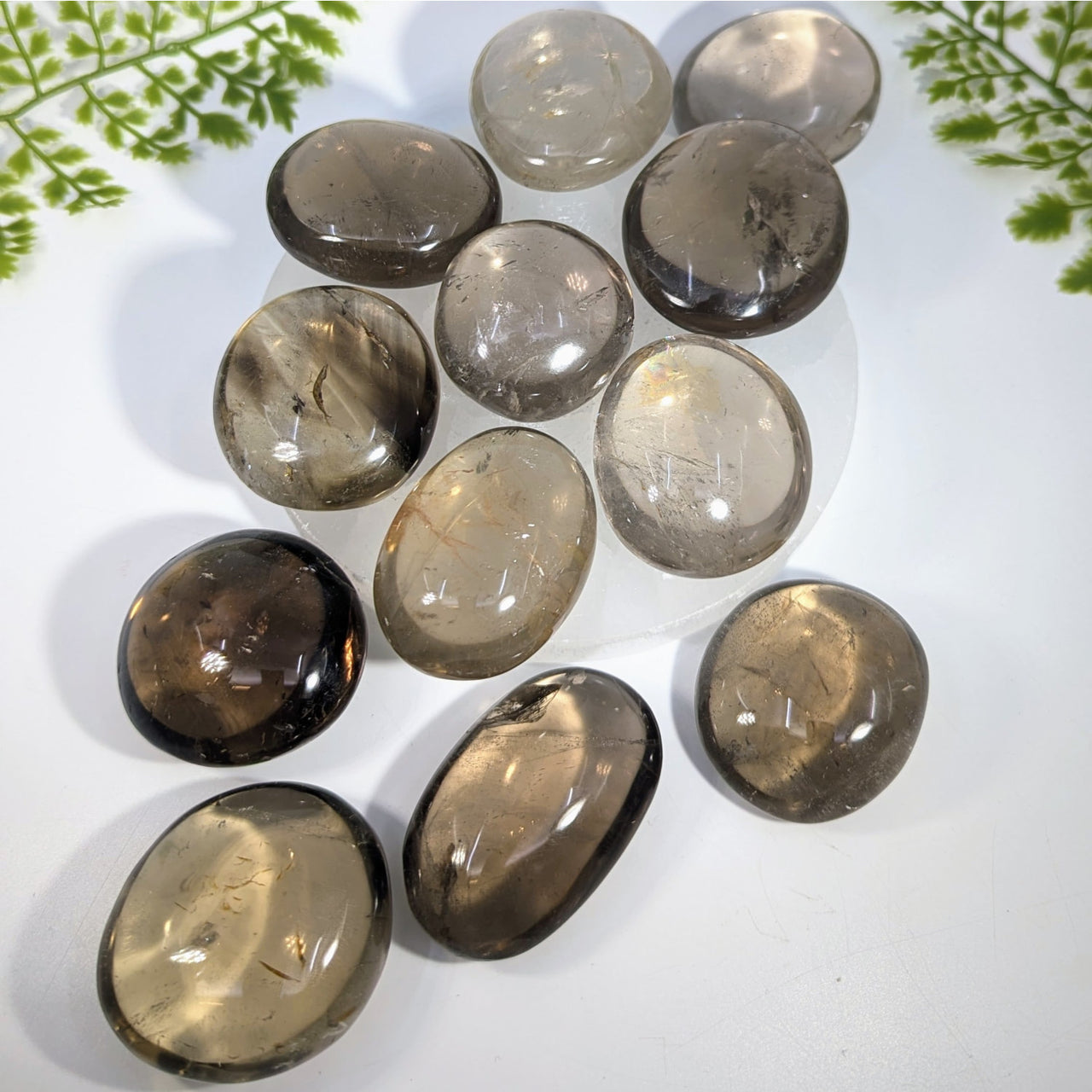 Smooth oval-shaped smoky quartz pebbles 2 to 2.25 inches with translucent brownish-gray crystals for jewelry and gemstones