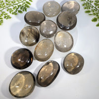 Smooth oval-shaped smoky quartz pebbles 2 to 2.25 inches with translucent brownish-gray crystals for jewelry and gemstones