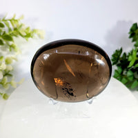 Smoky quartz 2.6 inch jumbo palm stone with smooth oval shape rich brown hue and natural inclusions