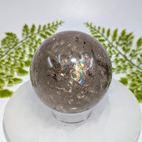 Polished 2.7in smoky quartz sphere BC1030 with rainbow sheen