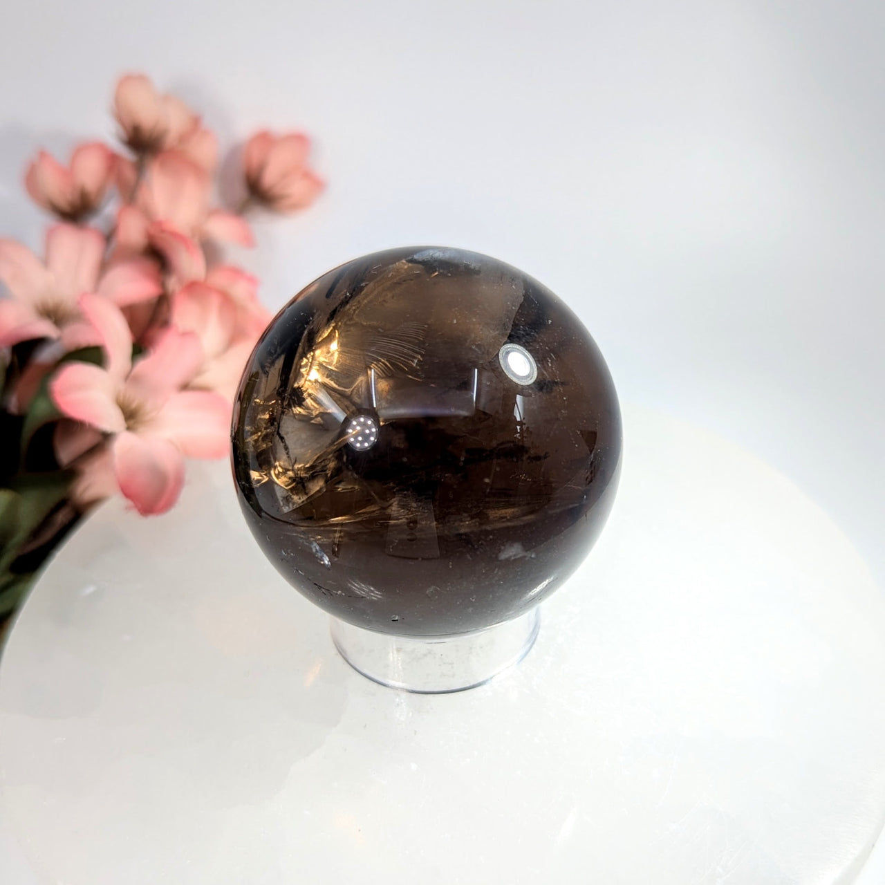 Polished 2-inch smoky quartz sphere with golden inclusions #BC0657