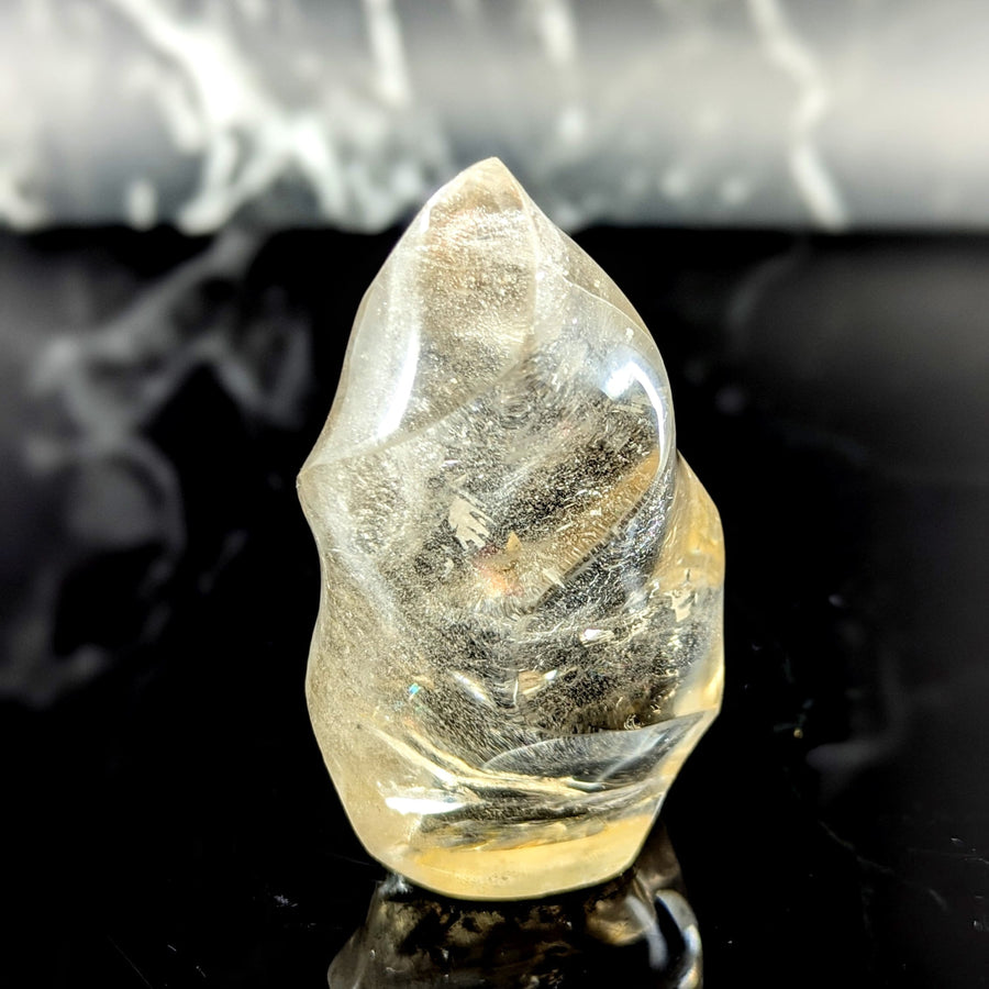 Smoky quartz 3.5 inch flame translucent pale yellow crystal with smooth polished surface and internal inclusions