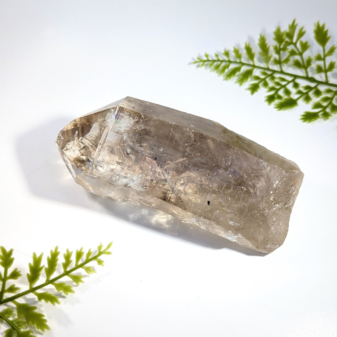 Smoky quartz 4.9 inch rough point with faceted geometric shape translucent light brown quartz crystal with inclusions