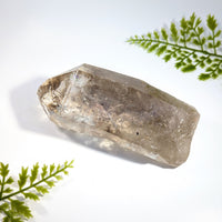 Smoky quartz 4.9 inch rough point with faceted geometric shape translucent light brown quartz crystal with inclusions