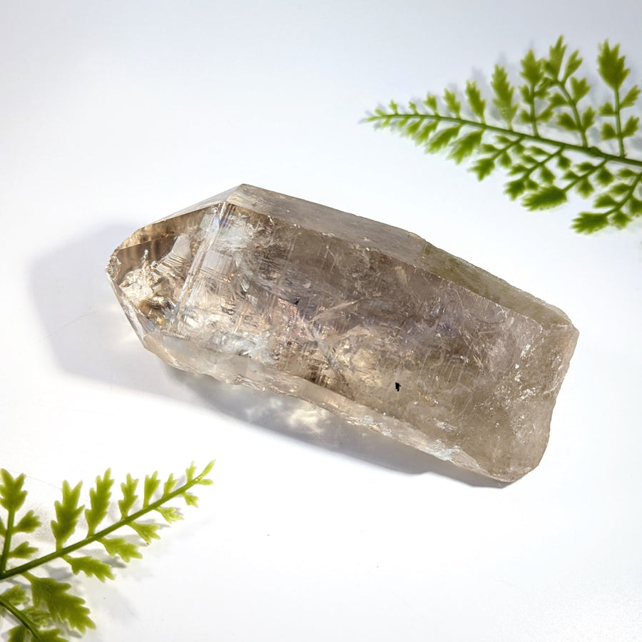 Smoky quartz 4.9 inch rough point with faceted geometric shape translucent light brown quartz crystal with inclusions