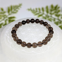 Smoky quartz 7-inch 8mm bead bracelet BC0935 with smooth translucent round beads