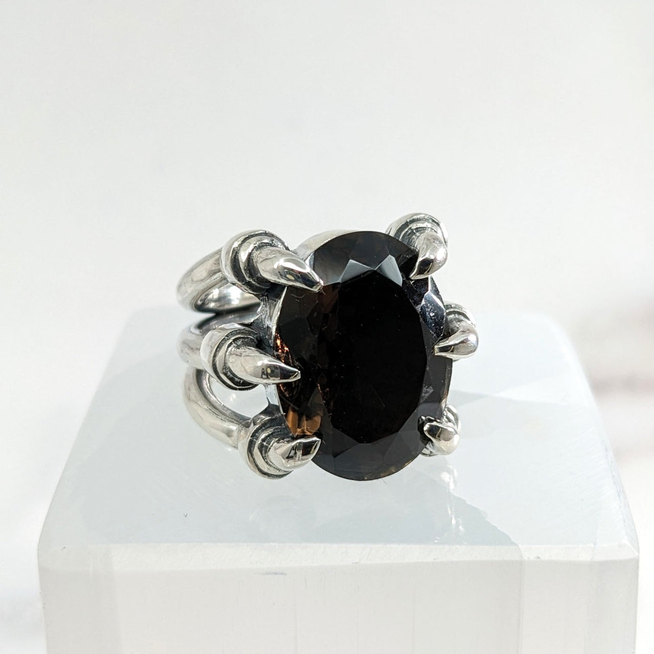 Smoky Quartz Jumbo S.S. Claw Ring Sz. 7.5 displayed on a white box with a black diamond