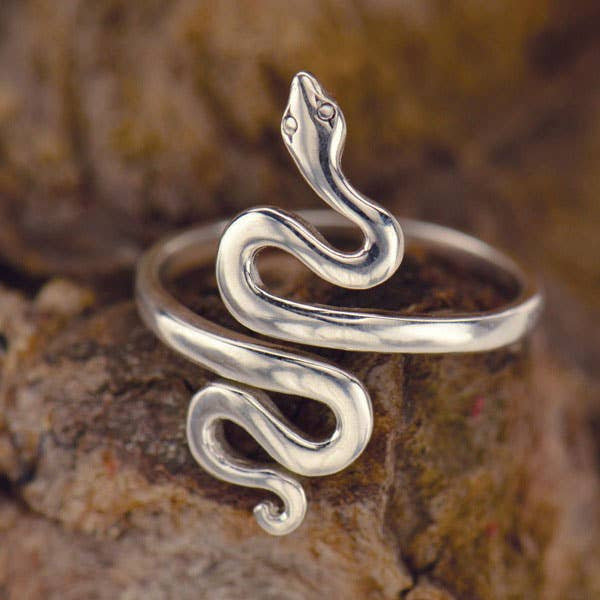 Snake Sterling Silver Adj. Ring #J020: Elegant silver snake ring displayed on a rock