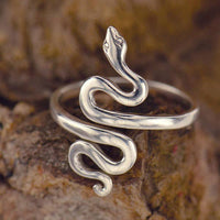 Thumbnail for Snake Sterling Silver Adj. Ring #J020: Elegant silver snake ring displayed on a rock