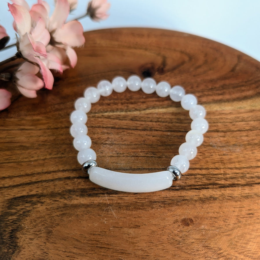 White beaded Snow Quartz Bridge Bracelet with curved centerpiece for elegant jewelry style