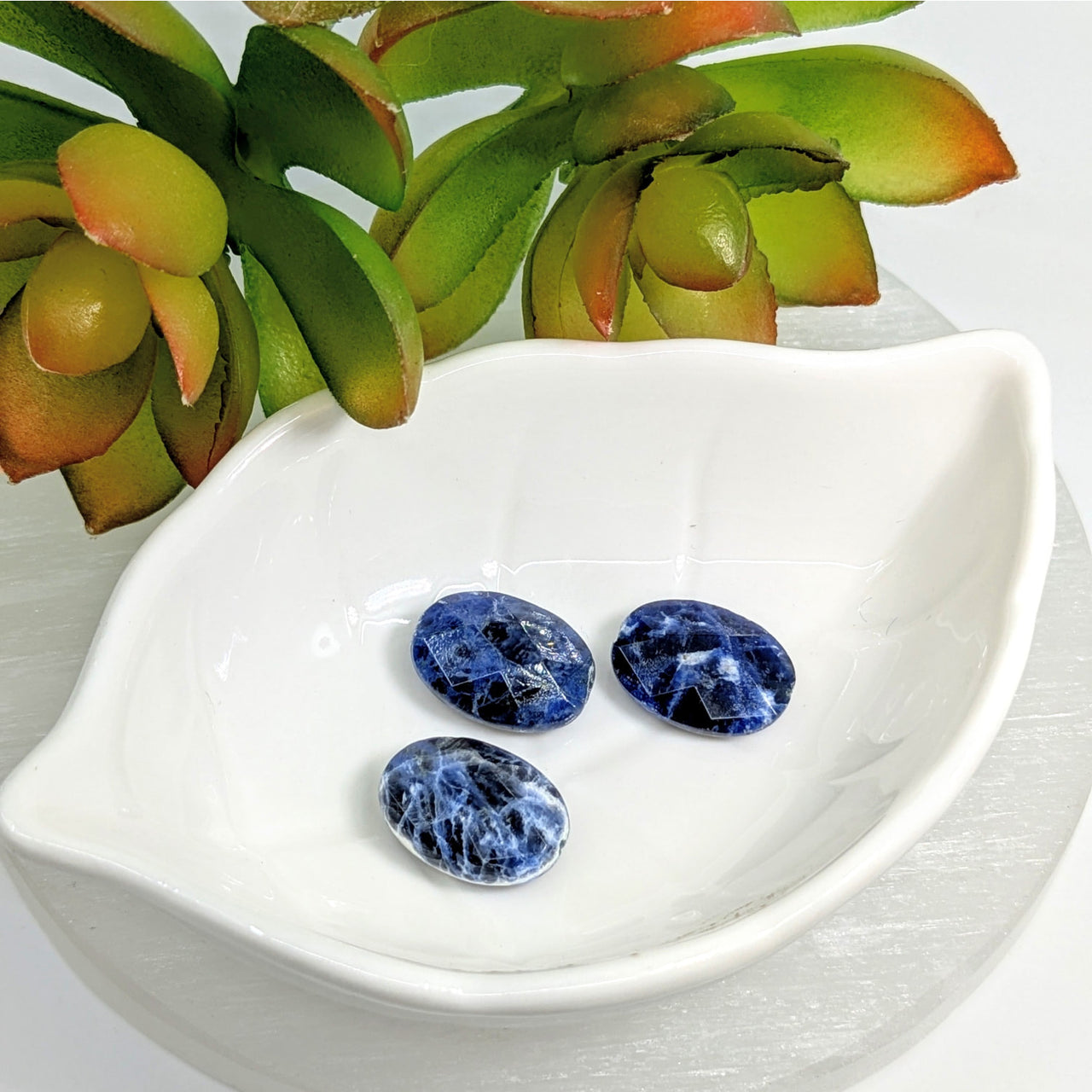 Three blue Sodalite Faceted 18mm Oval beads with white marbling patterns