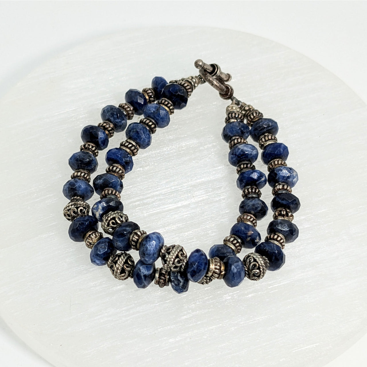 Double strand bracelet with blue Sodalite faceted 7’’ beads and ornate silver spacers