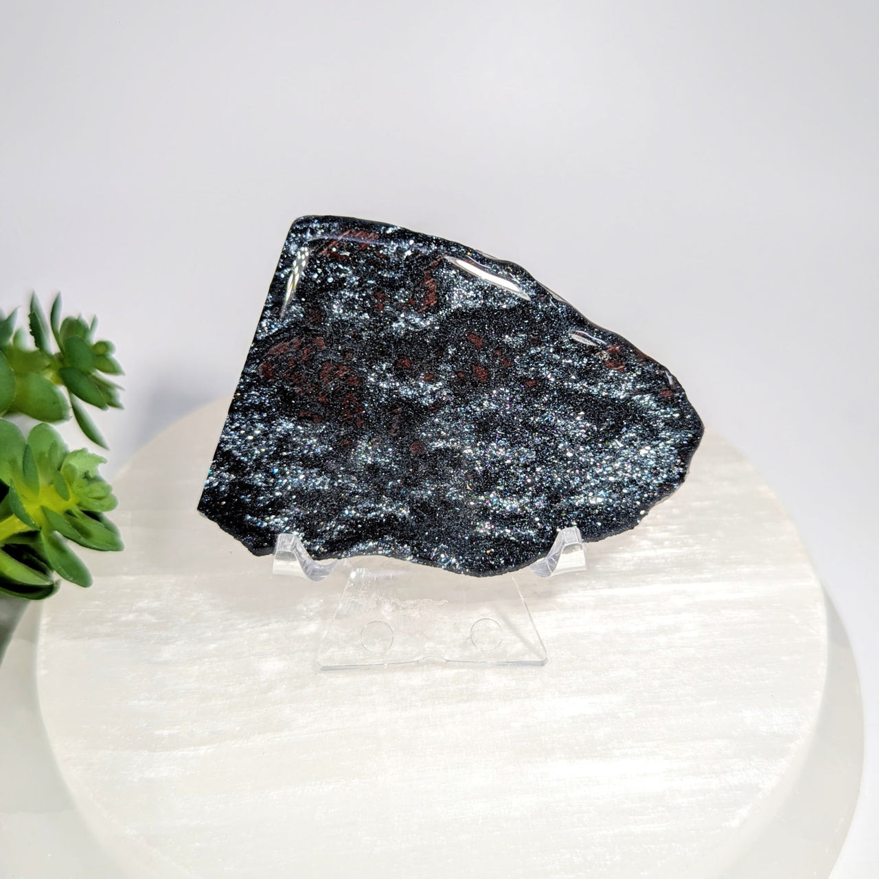 Specular hematite 2.4 inch polished stone slice on acrylic stand