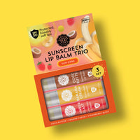SPF 50 sunscreen lip balm trio in cocoa butter, banana cream, strawberry flavors