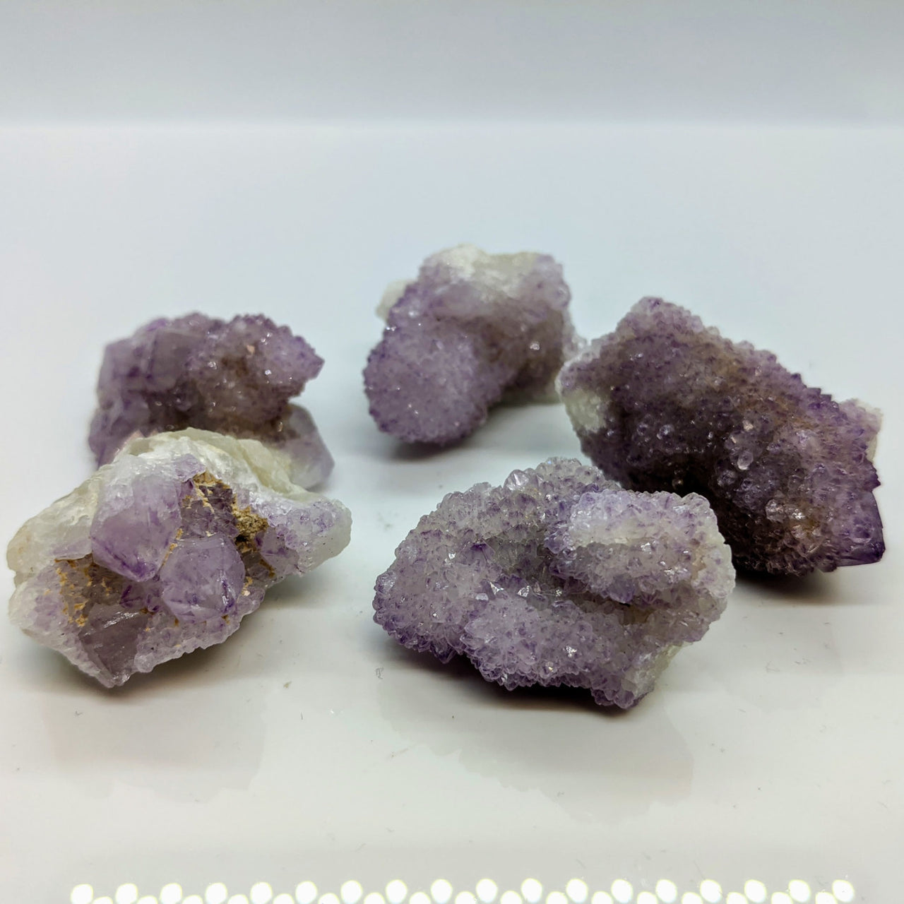 Spirit Quartz aka Amethyst Cactus Rough Cluster #LV0024 on white plate with amethyst crystals