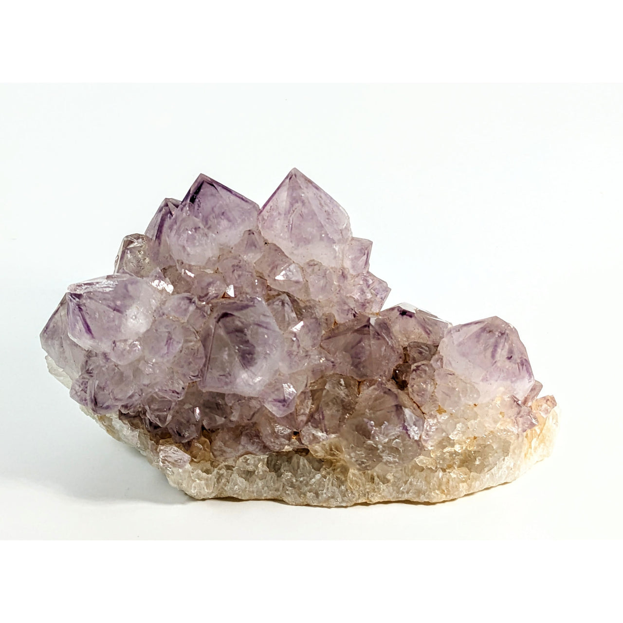 Translucent purple amethyst Spirit Quartz #R185 crystals on beige rock base
