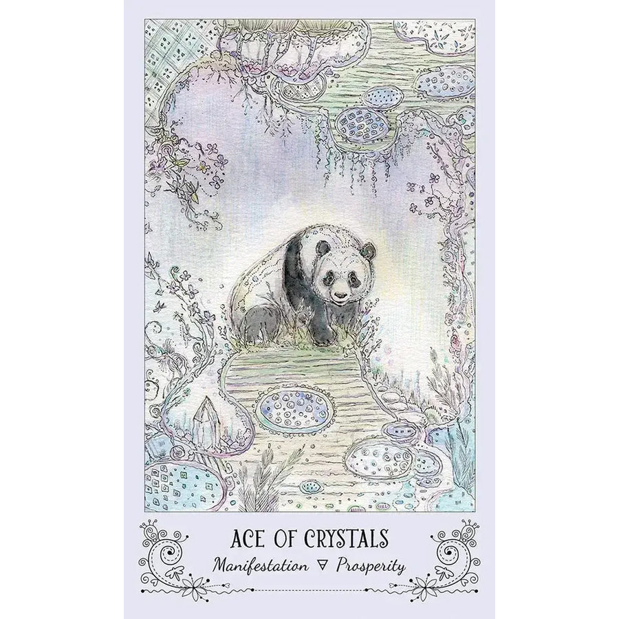 Panda bear on table with Spiritsong Tarot Deck by Paulina Fae in the background