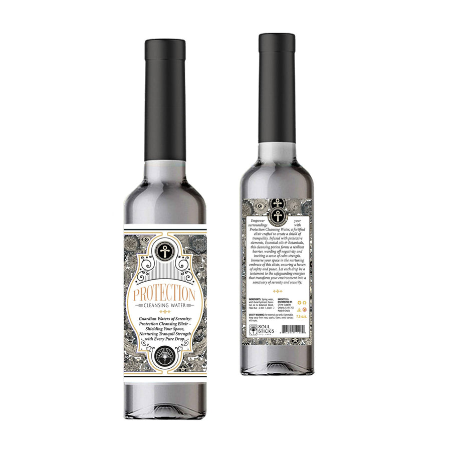 A sleek transparent glass bottle with a black cap and ornate cream and gray label for spiritual cleansing water protection 7.5 oz