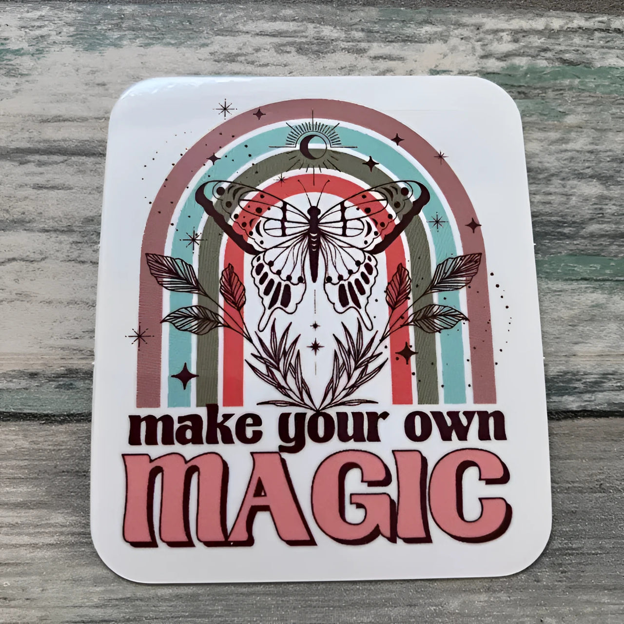 Retro butterfly sticker with rainbow design and Make Your Own Magic text