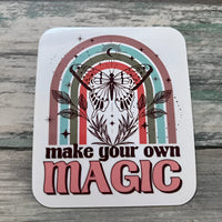 Retro butterfly sticker with rainbow design and Make Your Own Magic text