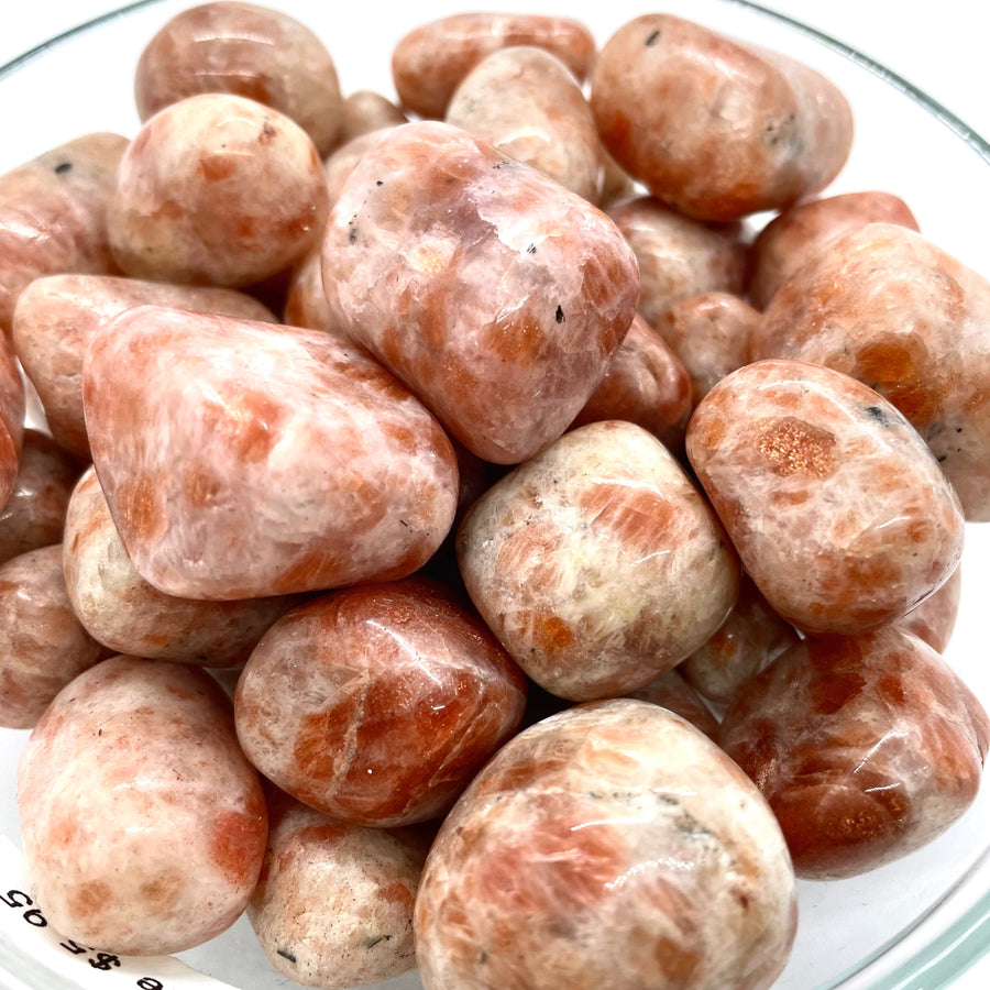Pile of polished Sunstone gemstones from Sunstone Tumbled #T042 display beauty and shine
