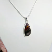 Thumbnail for Teardrop-shaped amber and black stone pendant on silver chain in Super 7 jewelry collection