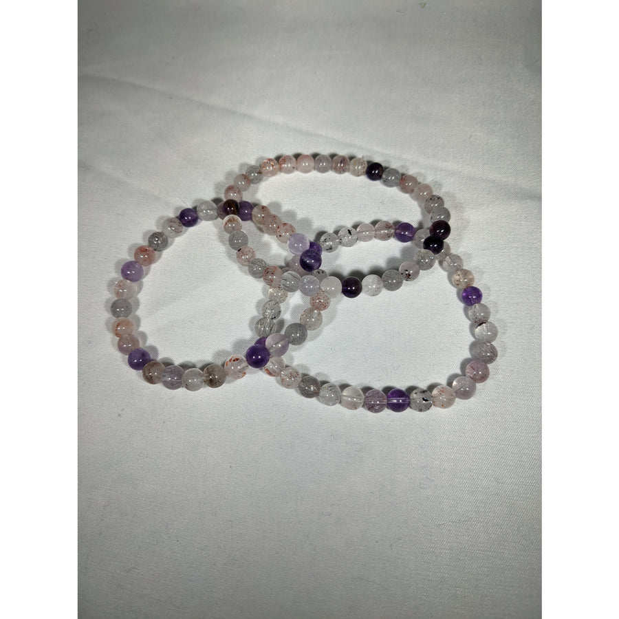 Three beaded Super Seven Bracelets 6mm in clear, purple, and pink crystals