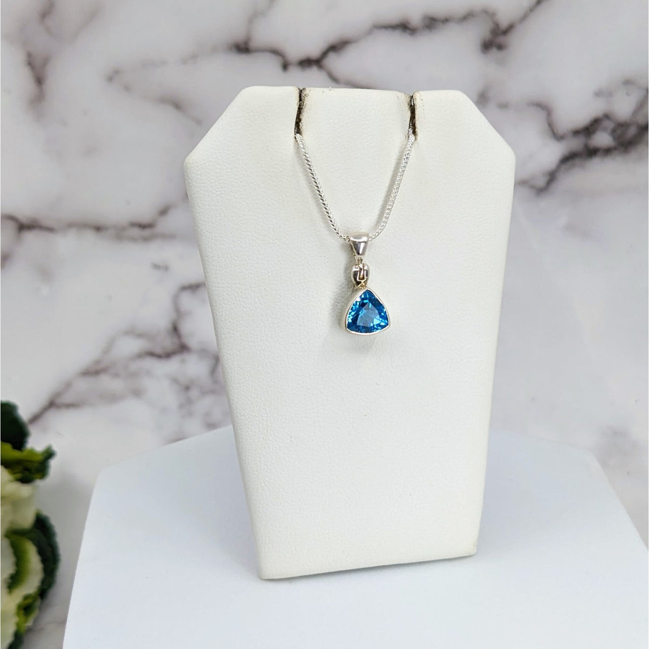 Swiss Blue Topaz Faceted Sterling Silver Pendant LV3326 on a white necklace