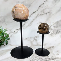 Thumbnail for Tall black metal stands holding large rocks, featured in the Tall Metal Sphere Stand #LV4034