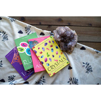 Thumbnail for Four colorful books on crystal card meanings beside an amethyst cluster in Tarot guide